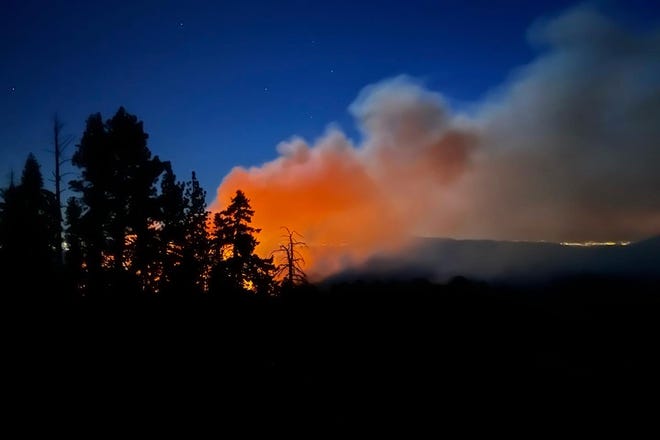 In this image released by the National Park Service, smoke from the Washburn Fire rises near the lower portion of the Mariposa Grove in Yosemite National Park on July 7.  (National Park Service via AP)