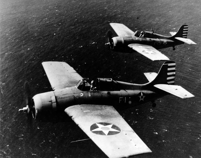 Lt. Cmdr. John S. Thach, foreground, and Lt. Edward H. "Butch" O'Hare are pictured flying F4F-3 Wildcat fighters over Hawaii in April 1942.