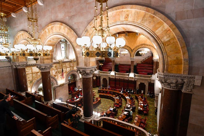 Members of the New York Senate, debate legislation to consider new firearms regulations for concealed-carry permits, during a special legislative session in the Senate Chamber at the state Capitol, July 1, 2022, in Albany, N.Y. A federal lawsuit challenging part of New York's new gun law was filed Monday, July 11, 2022, by Republican congressional candidate Carl Paladino, one of multiple legal challenges expected against state handgun licensing rules approved after a recent Supreme Court ruling. (AP Photo/Hans Pennink, File)