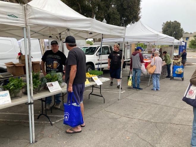 F & F Farms owner Fred Ellrott displays his produce at the Ventura County Certified Farmers' Market on Saturday, July 9, 2022.