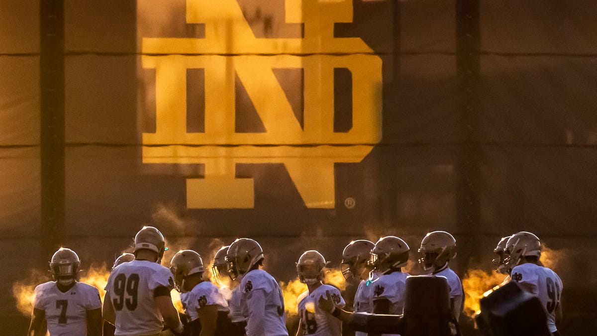 Notre Dame defensive players head outside to run dills during a Notre Dame football spring practice.