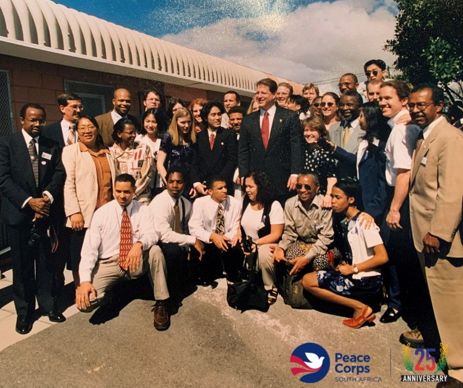 John Peterson helped the Peace Corps open its first program in South Africa in 1997. Peterson, second from the left, is seen here with the first group of volunteers and Vice President Al Gore.