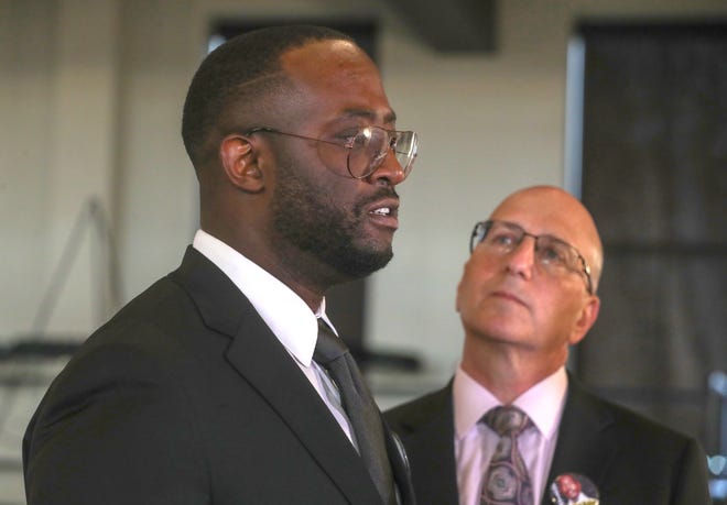 Roddray Walker, a first cousin to Jayland Walker, talks with the media Wednesday. At right is Ken Abbarno, an attorney for the family of Jayland Walker.