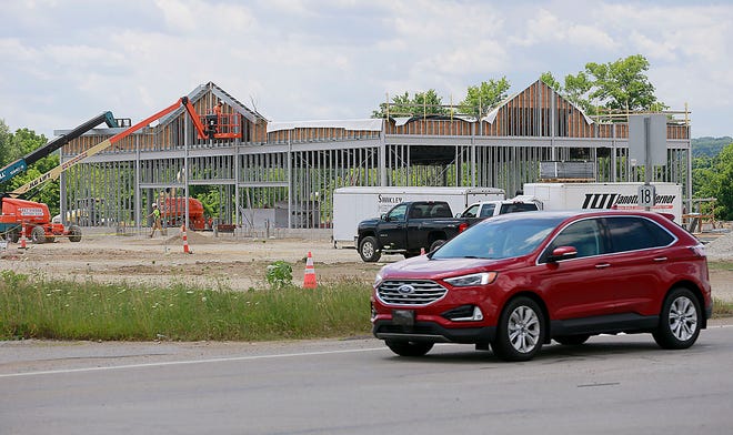 A vehicle travels east on U.S. Route 250 past the construction site of the Friendly Express gas station and travel center east of Interstate 71.