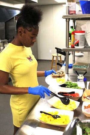 At MCOP's free summer program, The Clubhouse, local youth learn the fundamentals of cooking like making BLT sandwiches using marble bread and adding healthy options like mango and/or pineapple.