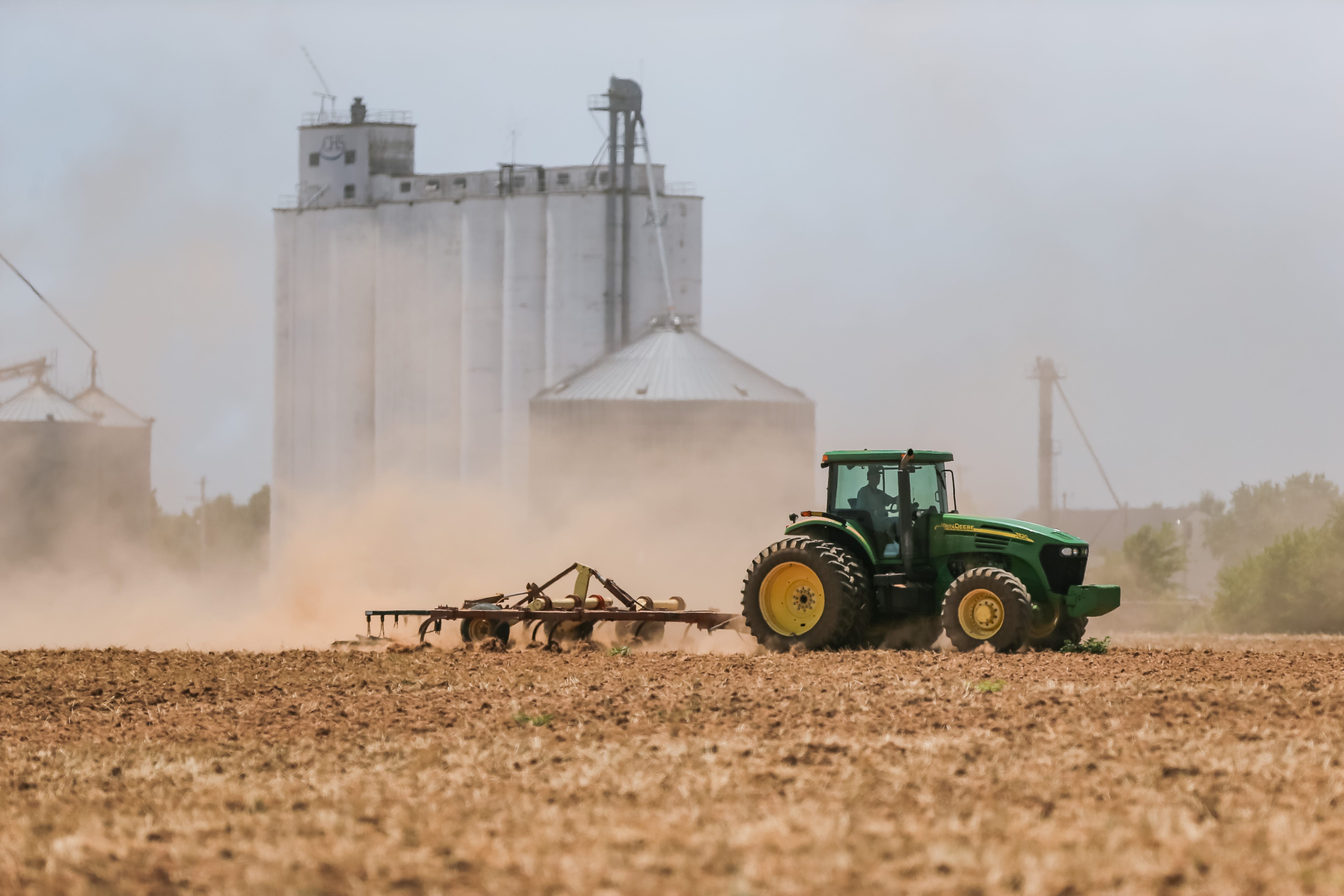 A farmer tills his land on Wednesday, July 13, 2022, southwest of Bridgeport, Oklahoma, after drier-than-normal conditions have caused a drought affecting farmers and ranchers in the area.