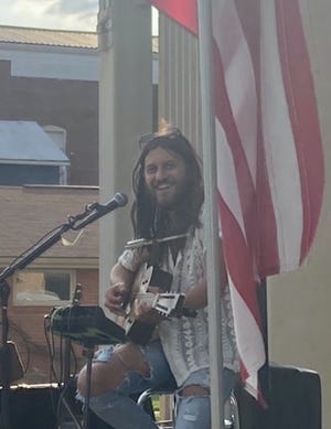 Micah Kesselring, of the Hocking Hills area, was the featured musician at Newcomerstown’ “Second Saturday” event on July 9.