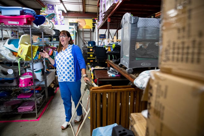 Pregnancy Center of the Coastal Bend Executive Director Jana Pinson tours the warehouse at the organization's Corpus Christi location on Tuesday, July 13, 2022.