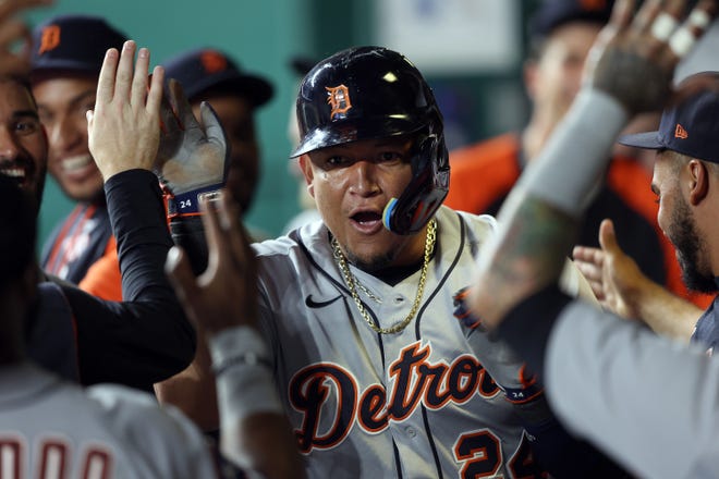 Tigers designated hitter Miguel Cabrera is congratulated by teammates in the dugout after scoring during the seventh inning on Tuesday, July 12, 2022, in Kansas City, Missouri.