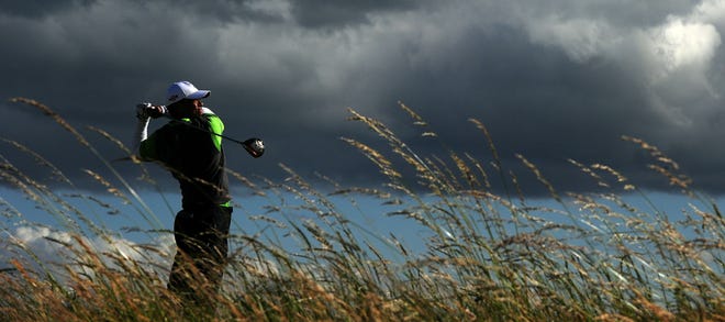 July 16, 2010 -- Tiger Woods watches his drive from the 6th tee during his second round at the British Open at St. Andrews.