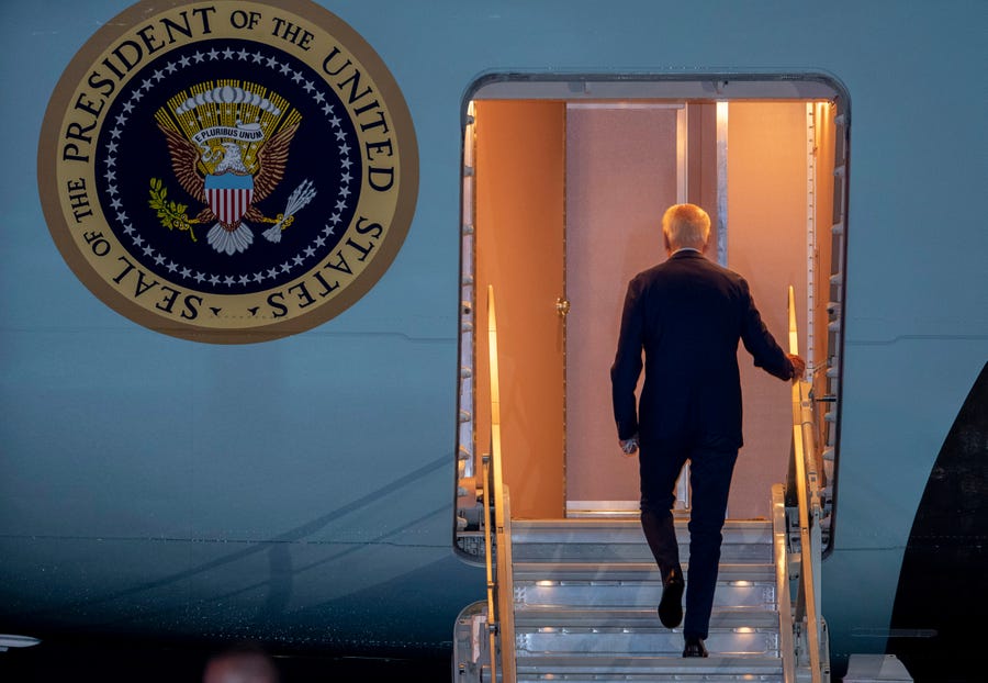 President Joe Biden boards Air Force One for a trip to Israel and Saudi Arabia, Tuesday, July 12, 2022, at Andrews Air Force Base, Maryland.