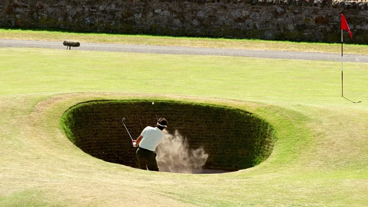 Jean Van de Velde of France plays out of the Road Hole bunker on the 17th during the second round of the British Open on the Old Course at St Andrews in Scotland.