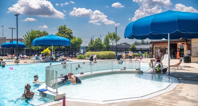 Residents enjoy the Grandview Heights Municipal Pool on July 13. The pool has changes in its admission policies and the parks and recreation department has new programs scheduled for the summer.