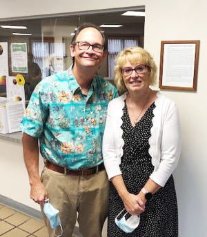 Dr. Heather Schweizer, right, and her husband, Jeff, are shown at the OSF Medical Group office in Fairbury.