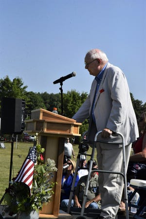Former U.S. Congressman and Battle Creek mayor Dr. Joe Schwarz, a U.S. Navy veteran and former member of the Defense Intelligence Agency and Central Intelligence Agency, delivers the keynote address during the opening ceremony for The Wall That Heals Vietnam Veterans Memorial Replica at Harper Creek Community Schools in Emmett Township on Thursday, July 14, 2022.