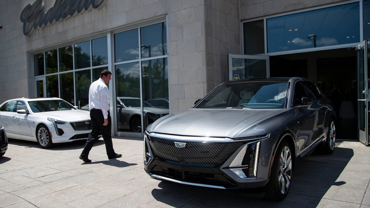 Cadillac of Novi general manager Ed Pobur drives the Cadillac Lyriq out of the showroom after delivering it to the customer at the dealership on Thurs., July 14, 2022.