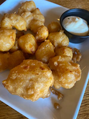 Beer battered cheese curds at Bar 430 in Oshkosh come with a garlic aioli that's like ranch dressing dialed up to 11.