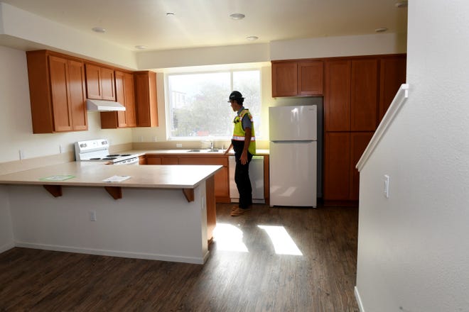 The Westview Village housing project under development in Ventura has reserved 20 of its 320 affordable rental units for homeless individuals and previously homeless families. Dan Locascio, a construction superintendent for Westview, stands in a kitchen of a nearly completed building on July 14.