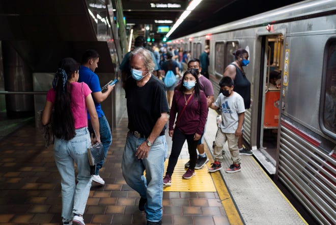 Commuters at a Metro station in Los Angeles. As of late September 2022, 36% of organizations required workers to be in the office at least three days a week, up from 25% in August, according to a Gartner survey.