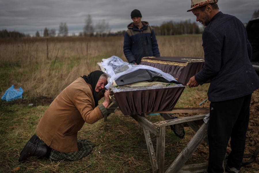 Nadiya Trubchaninova, 70, cries while holding the coffin of her son Vadym, 48, who was killed by Russian soldiers last March 30 in Bucha, during his funeral in the cemetery of Mykulychi, on the outskirts of Kyiv, Ukraine, Saturday, April 16, 2022. Ministers from dozens of nations are meeting on Thursday, July 14, 2022 in the Netherlands to discuss with the International Criminal Court's chief prosecutor how best to coordinate efforts to bring to justice perpetrators of war crimes in   Ukraine.