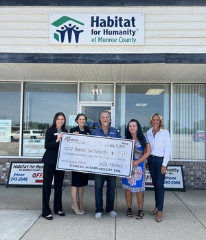 A check for $1,285 was presented recently to Habitat for Humanity of Monroe County. The funds were provided through Monroe Community Credit Union's Member Match program.
Pictured are (from left) April Eggert, marketing specialist at MCCU; Kate Hall, vice president of marketing and community relations at MCCU; David Graves, president/CEO of Habitat for Humanity of Monroe County; Molly Moore, director of family services for Habitat, and Staci Jennings, volunteers and social media coordinator for Habitat.
Provided by MCCU