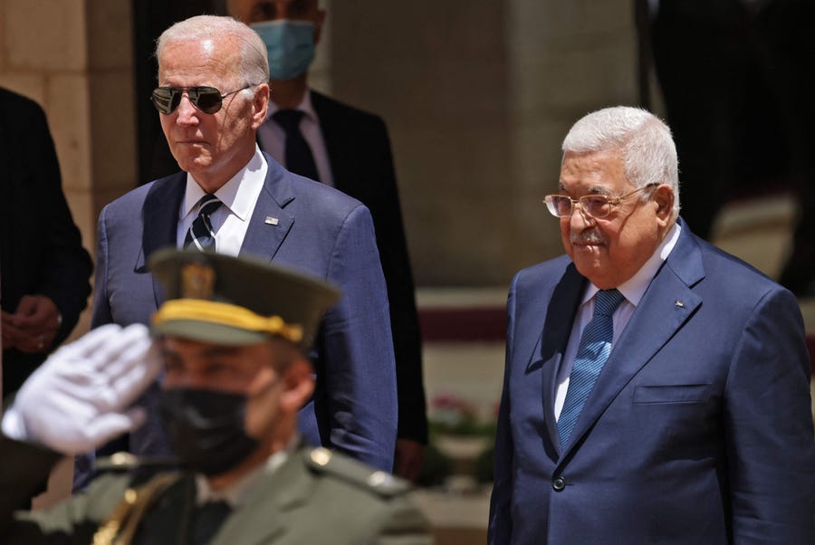 US President Joe Biden (L) is received by Palestinian President Mahmud Abbas during a welcome ceremony at the Palestinian Muqataa Presidential Compound in the city of Bethlehem in the occupied West Bank on July 15, 2022.