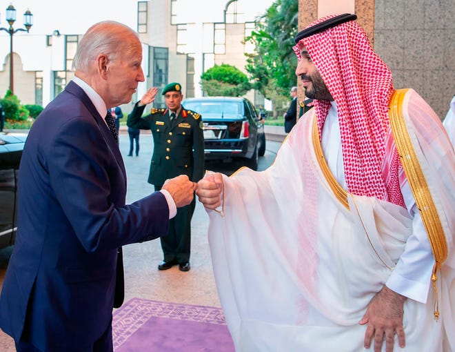 In this photo released by Saudi Press Agency (SPA), Saudi Crown Prince Mohammed bin Salman, right, greets President Joe Biden with a fist bump after his arrival in Jeddah, Saudi Arabia, Friday, July 15, 2022.