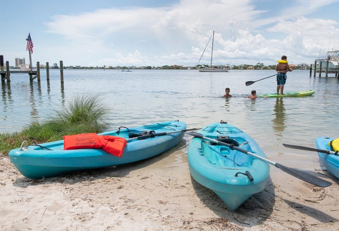 Children enjoy the water sports at Innisfree's Surf & Sand Hotel in Pensacola Beach on Friday, July 15, 2022. The hotel has added more complimentary equipment available to guests.