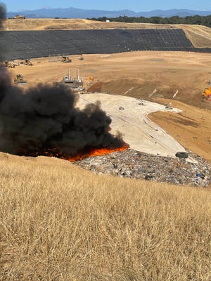 Firefighters put out a quarter-acre fire that started in the afternoon on Saturday, July 16, 2022, at the Anderson Landfill on Cambridge Road in Anderson.