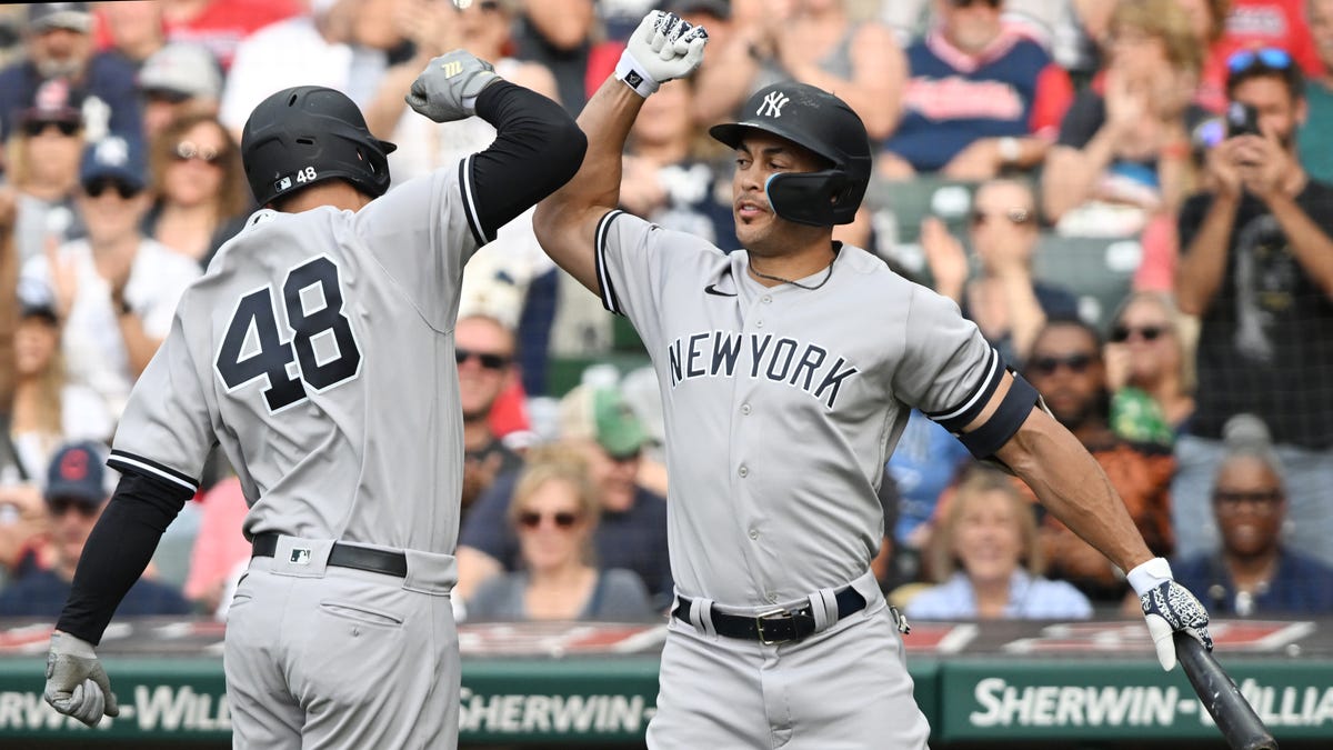 Anthony Rizzo and Giancarlo Stanton celebrate a home run.