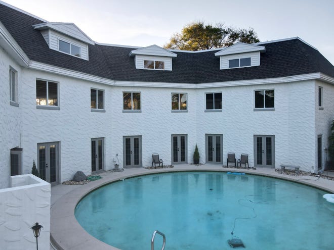 This $2-million castle-like home on John Anderson Drive has an enclosed courtyard that surrounds the 45,000-gallon pool.