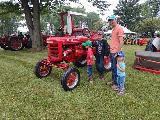 Steve Roznowski  and his children, Gabe, 9, Isaac, 5, and Clara, 2, attended the antique tractor show near Carleton during the weekend.