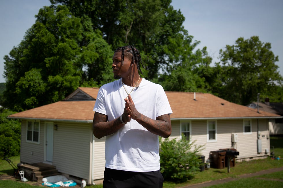 Tee Higgins poses in front of his childhood home in Oak Ridge, Tenn., on Friday, June 10, 2022. The 23-year-old Cincinnati Bengals receiver retold the story of an incident that nearly took his mother’s life. On Oct. 18, 2005, six-year-old Higgins was signed out early from his kindergarten class to learn his mother had been shot in the head, two times, by a man she had been purchasing drugs from. 