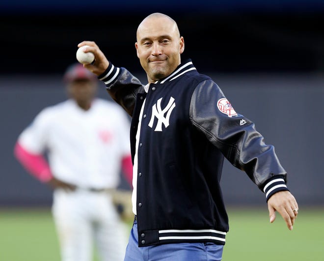 Former New York Yankees shortstop Derek Jeter throws out the ceremonial first pitch after a pre-game ceremony retiring his No. 2 at Yankee Stadium in 2017.