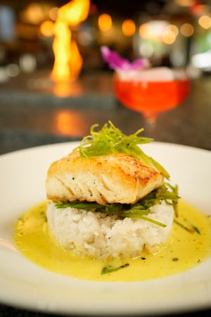 Pan-seared halibut with an Island Negroni cocktail from Kona Craft Kitchen