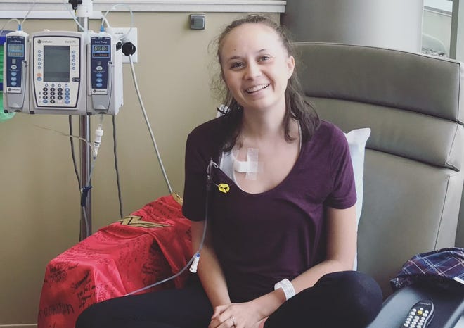 Rockford native Savannah Strandin smiles during a chemotherapy session in 2018.