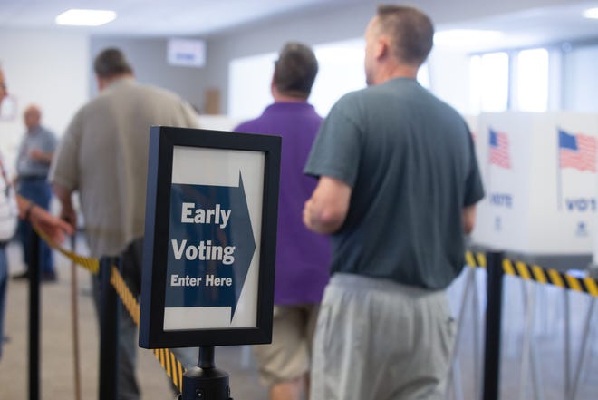Residents of Shawnee County enter the lines for early voting at the election office,  3420 S.W. Van Buren St., Monday morning.