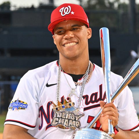 Juan Soto celebrates his win with the trophy and d