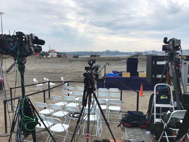 The stage is set at the former Brayton Point Power Station property in Somerset, Mass., for President Joe Biden's visit, on Wednesday, July 20, 2022.