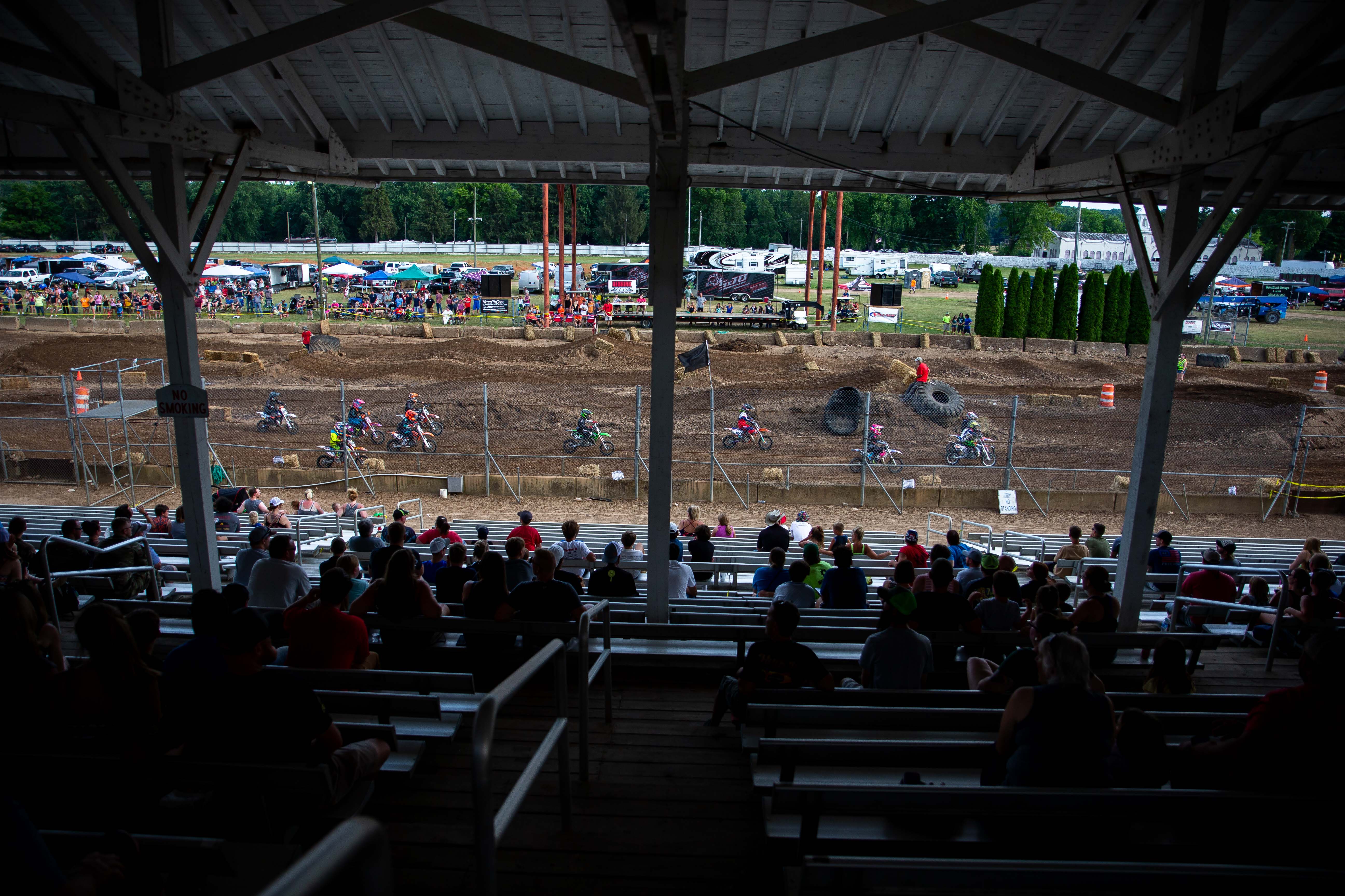 Motocross races bring crowds to the grand stands of the Ionia Free Fair Tuesday, July 19, 2022. The event brought riders of all ages to race around the dirt track. 