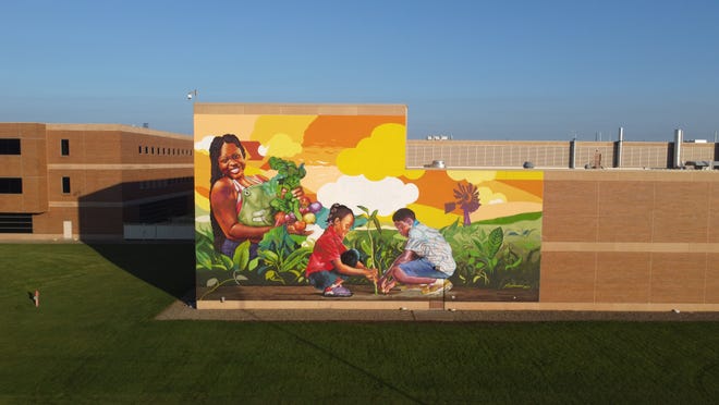 The "Black History Every Month" mural was unveiled Tuesday, July 19, 2022 at the W.K. Kellogg Institute for Food and Nutrition Research building in downtown Battle Creek.