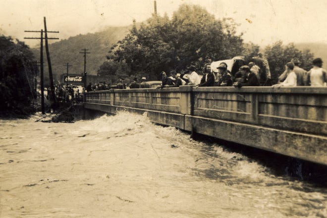 This photograph shows Swannanoa locals watching flood waters during the flood of August 1940.