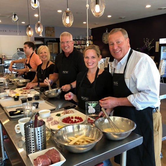 Couples prepare dessert during date night cooking class at Out of Thyme.