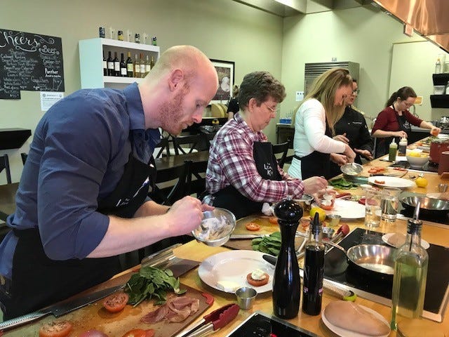 Working on a dish at The Learning Kitchen