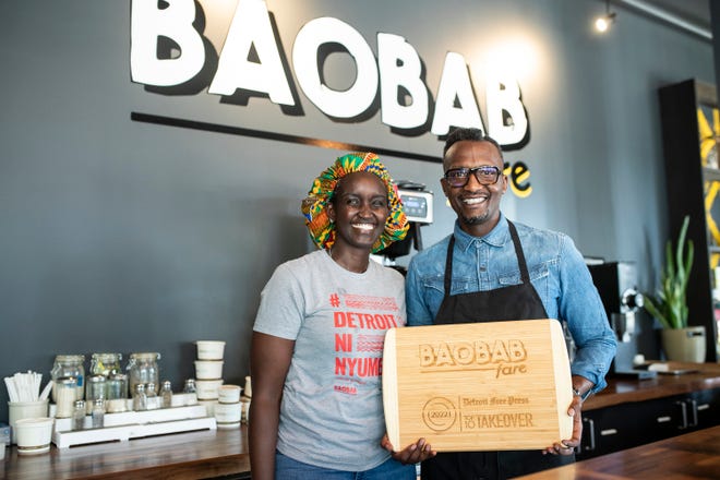 Co-owners Nadia Nijimbere and Hamissi Mamba show off their plaque after being named one of the best new restaurants during the Detroit Free Press Top 10 Takeover of Baobab Fare  earlier this year.