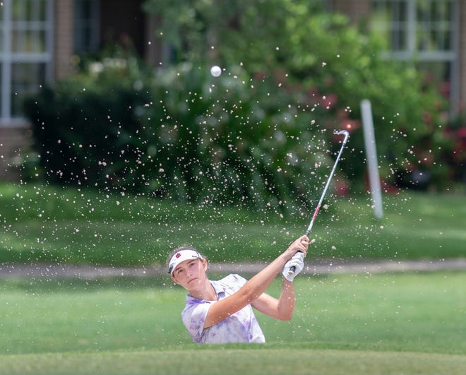 Gabby Hultstrand, of Pensacola, hits onto the green from a sand trap during the Divot Derby at Tiger Point Golf Club in Gulf Breeze on Wednesday, July 20, 2022.