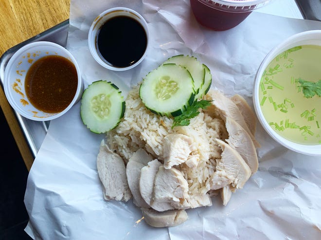 The white meat lover has skinless chicken pieces with cucumbers and garlic rice. During lunch it comes with a Thai iced tea.