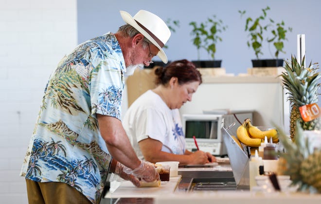 Guy and Teresa Keehner make acai bowls at their new restaurant Springfield Acai Bowl on Republic Road on Tuesday, July 19. 2022.