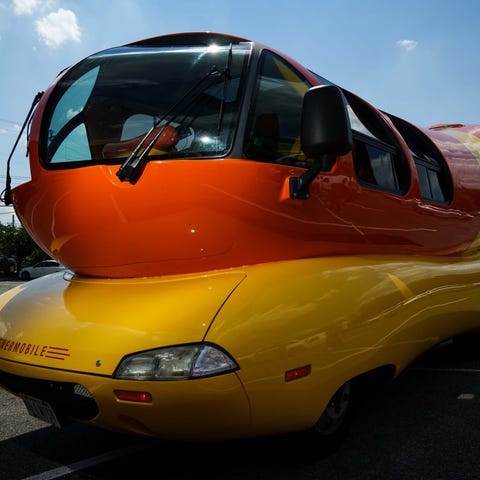 The Oscar Mayer Wienermobile is parked in a Giant 