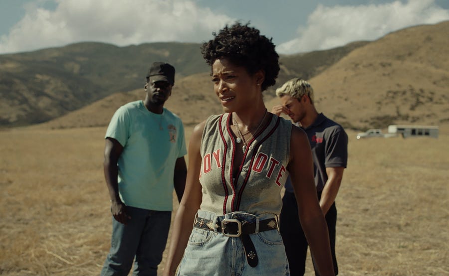 Emerald Haywood (Keke Palmer, center, with Daniel Kaluuya and Brandon Perea) gets roped into a bunch of weirdness on the family ranch in "Nope."